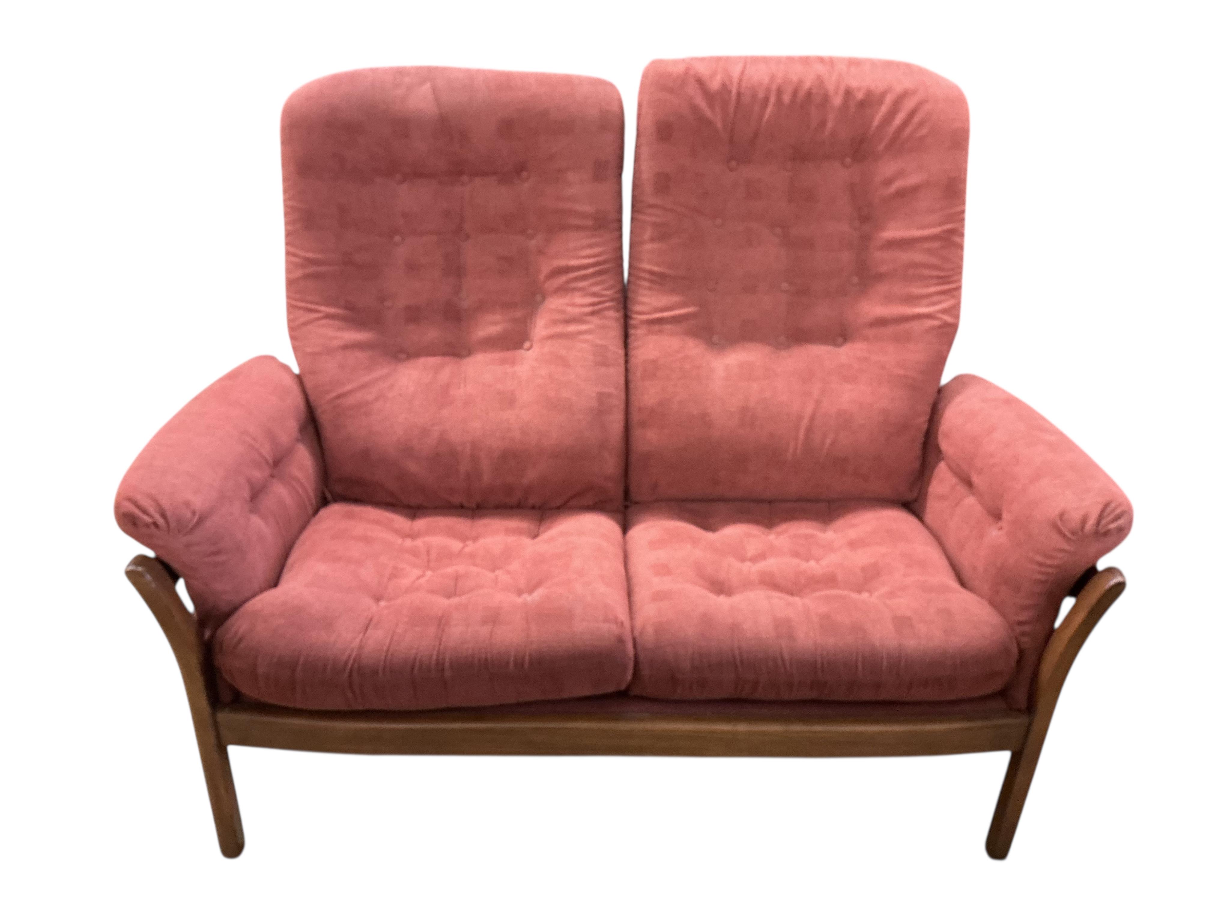 An Ercol elm three piece suite, settee width 130cm, depth 68cm, height 104cm